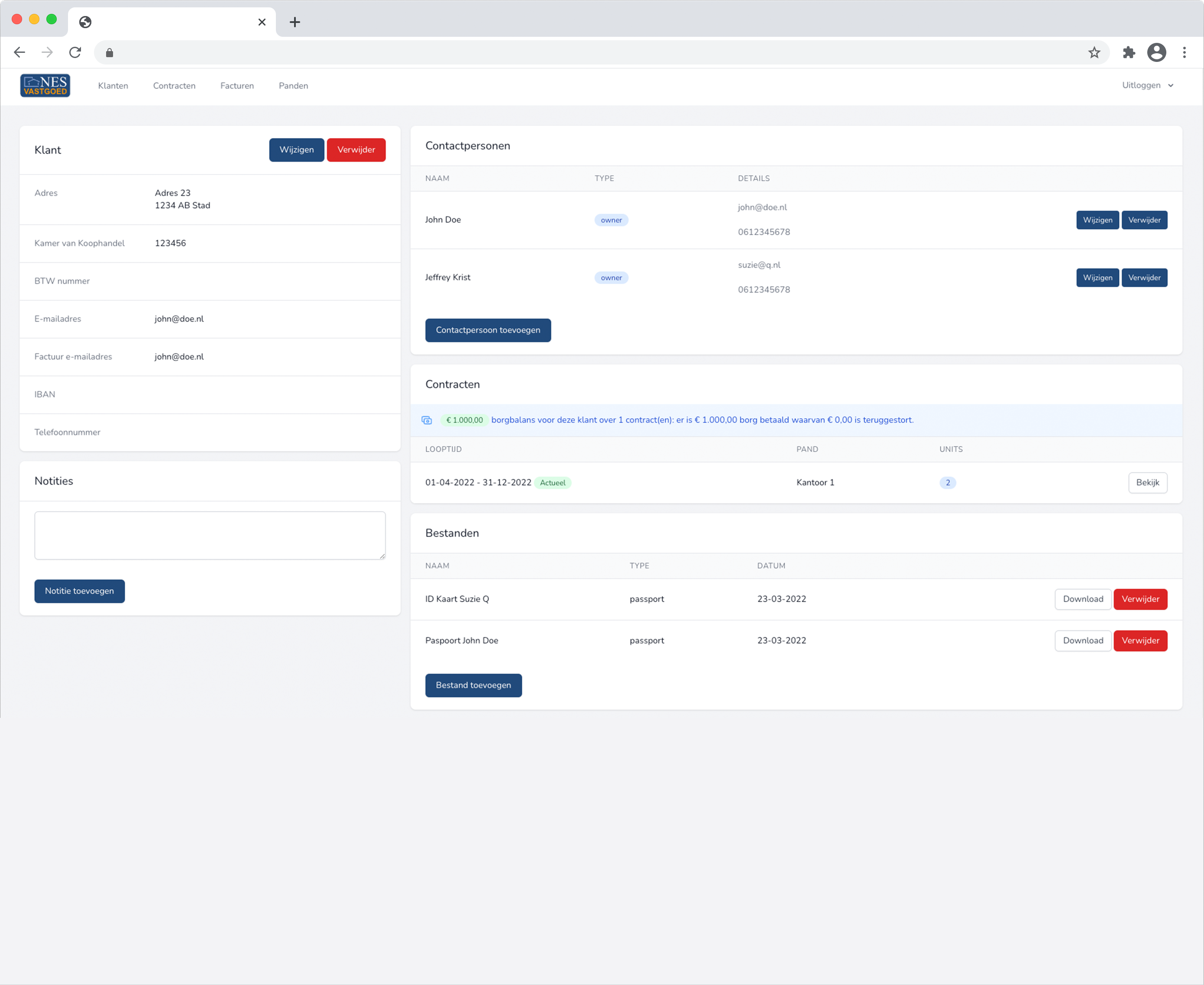 Whitney leaning against a railing on a downtown street